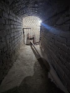 The tunnel connecting the printing press to the well shaft.